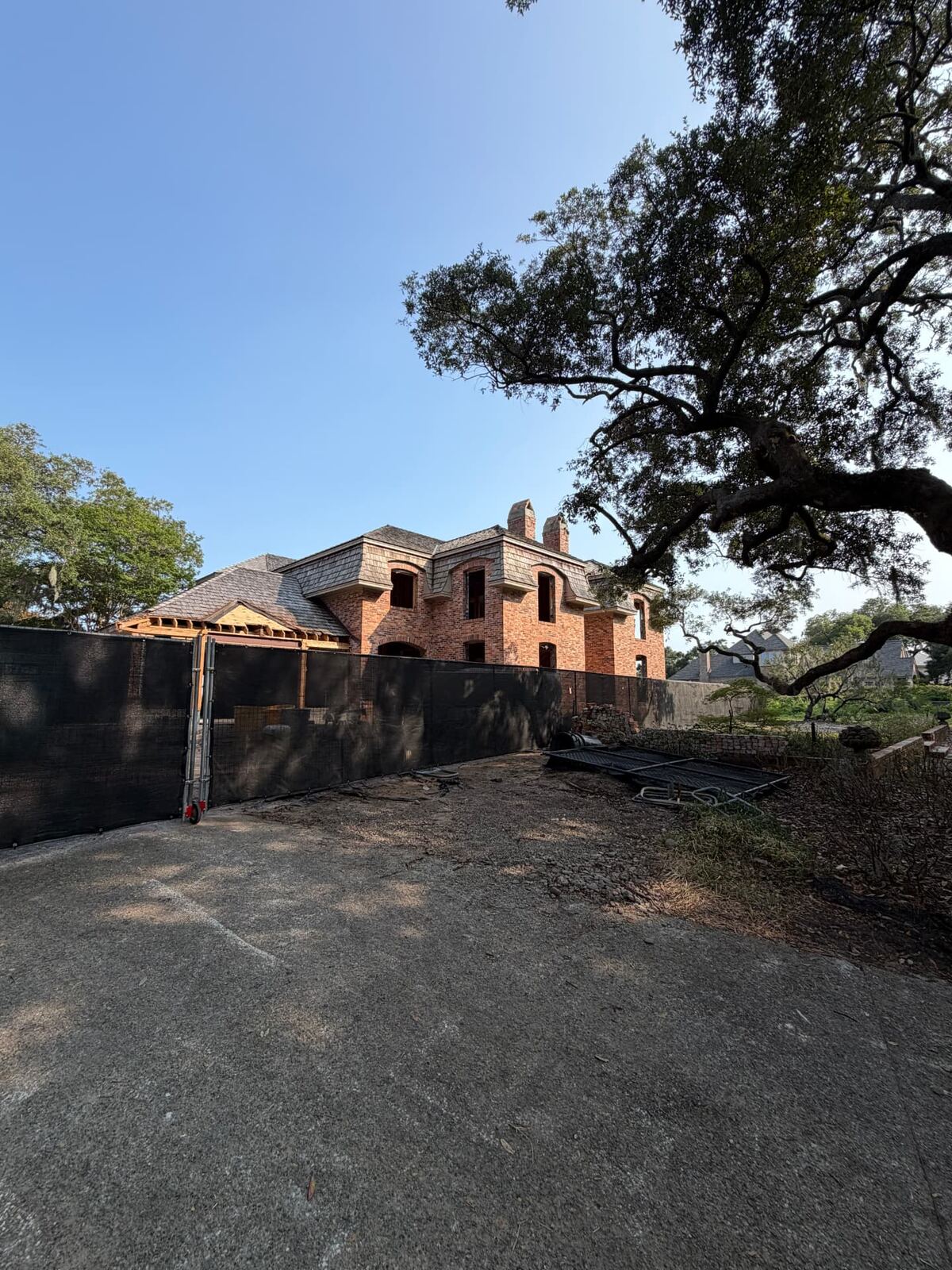Temporary fence with black screen around a residential lot