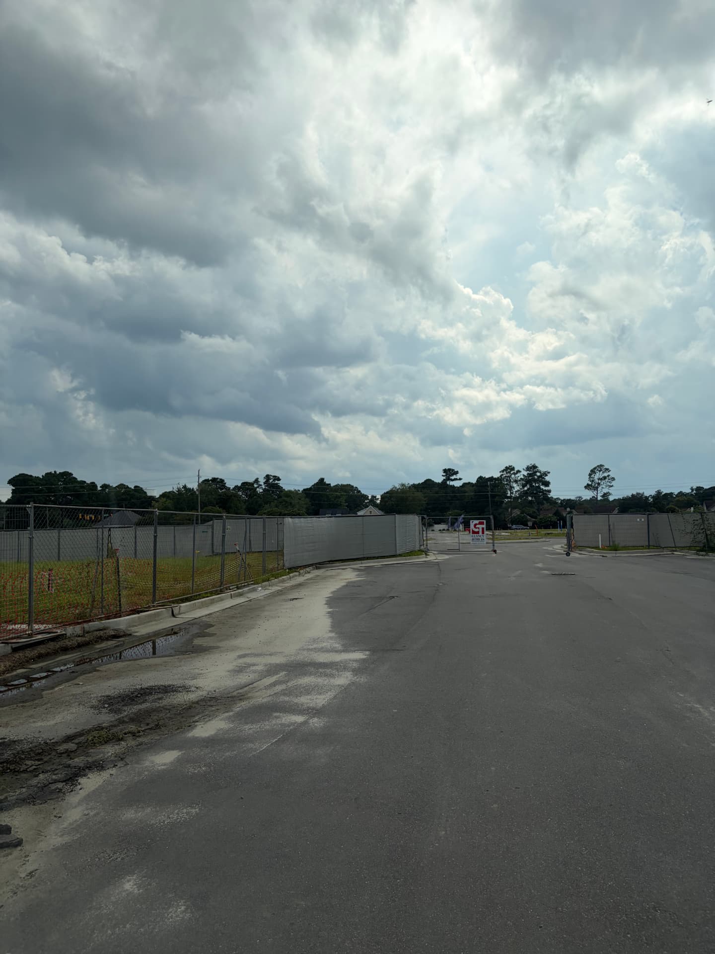 Temporary fence along a new road at a large development site